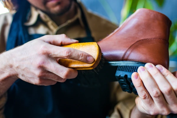 skilled shoemaker make a leather shoes in workshop