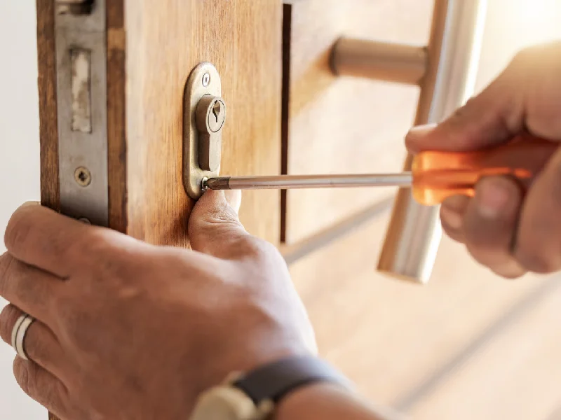 Locksmith hands, maintenance and handyman with tools, home renovation and fixing, change door locks